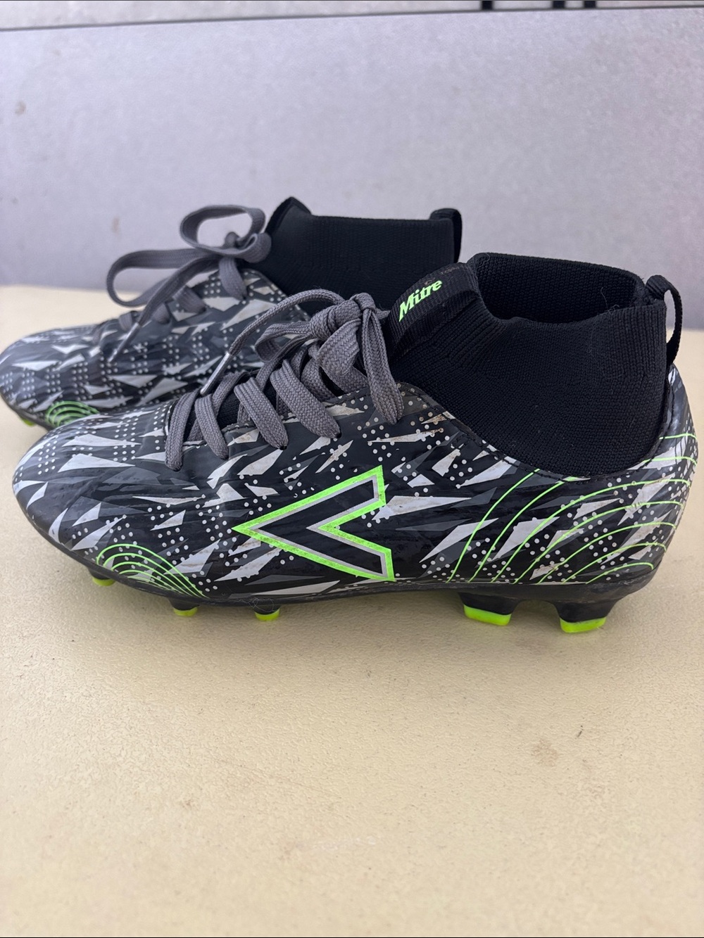 Kids' Black Soccer Cleats with Neon Green Accents